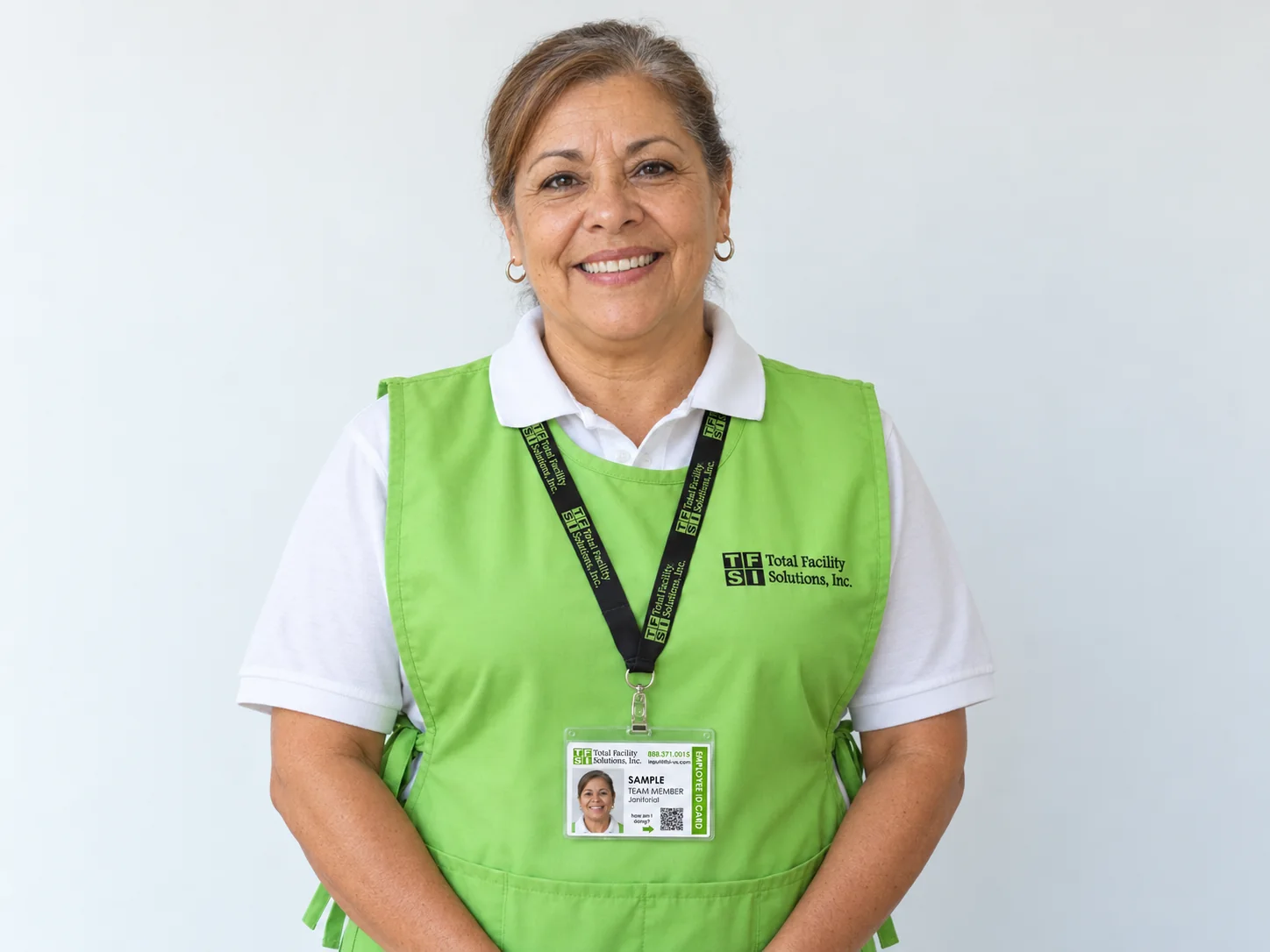 Illustration of a fictional uniformed TFS team member displaying a sample photo identification badge